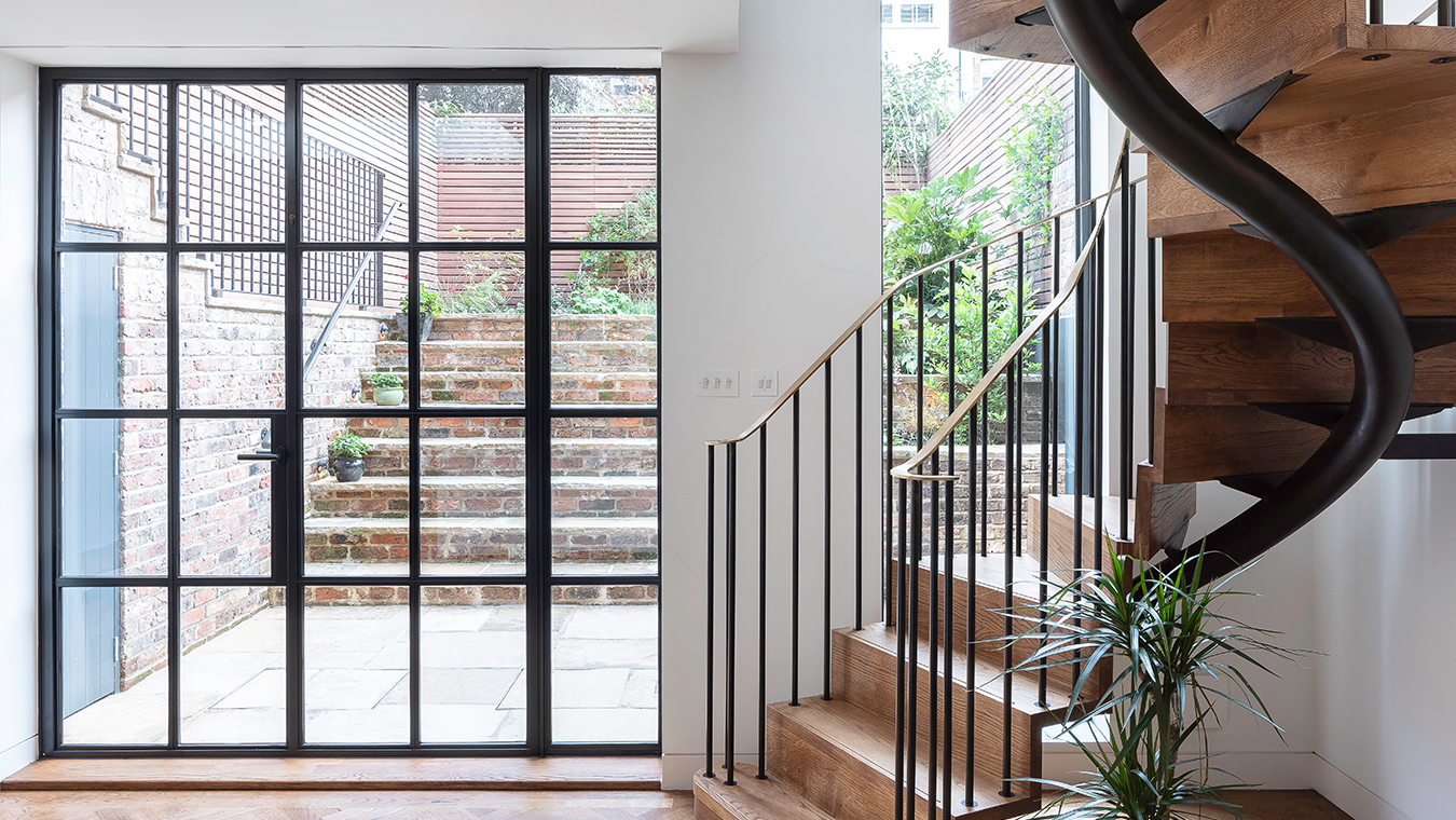 Direct access to the redesigned rear garden from the spiral staircase base