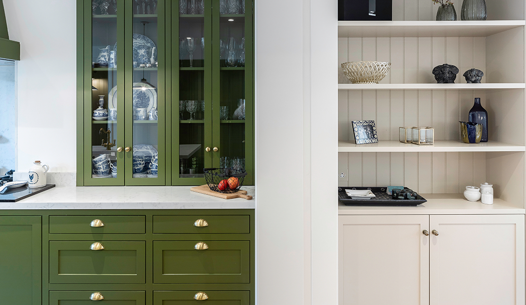 Expansive open-plan kitchen with olive green cabinets