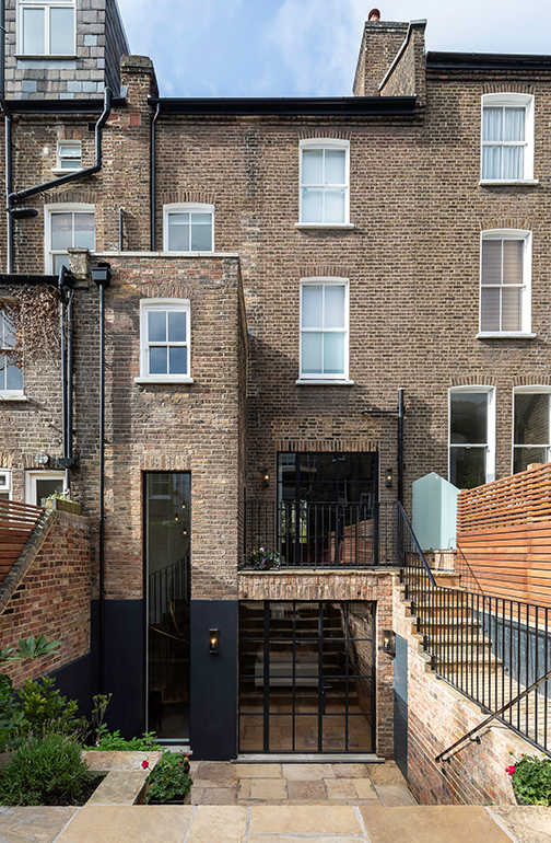 Rear exterior showing expansive crittall-style glazed doors