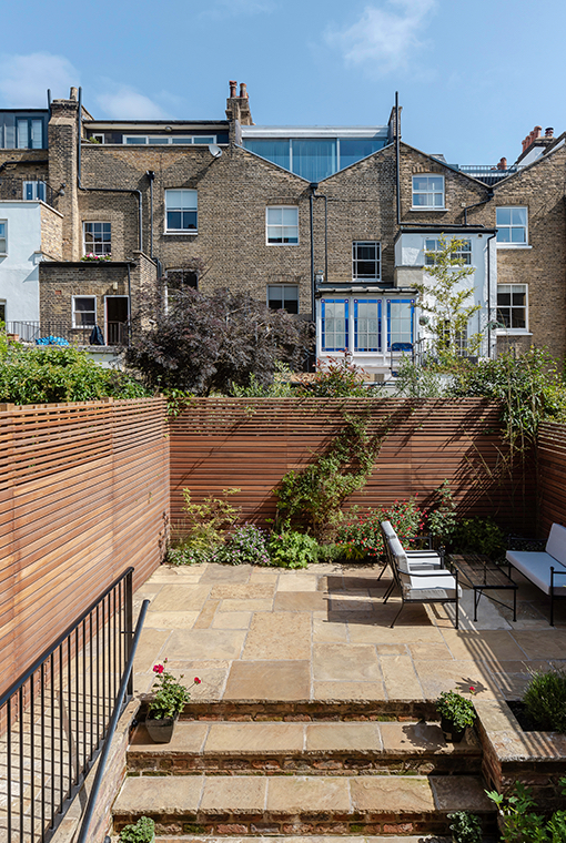 Redesigned rear garden with stepped and tiered greenery